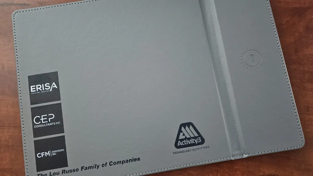 Custom branded mouse pad and phone charger for Lou Russo Family Businesses